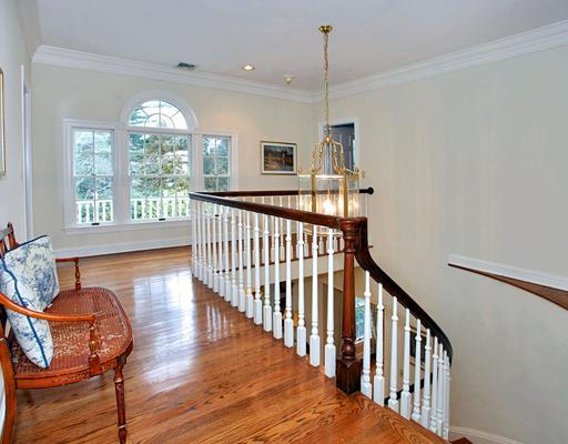 5 Shields Lane Darien, CT 06820 - Photo 13 of 20 a view of a room with wooden floor windows and a chandelier