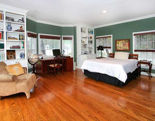 5 Shields Lane Darien, CT 06820 - Photo 14 of 20 a spacious bedroom with a bed a couch and large window