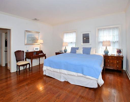 5 Shields Lane Darien, CT 06820 - Photo 17 of 20 a bedroom with a bed and wooden floor