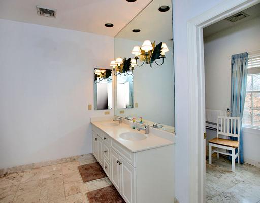 5 Shields Lane Darien, CT 06820 - Photo 18 of 20 a bathroom with a double vanity sink and a mirror