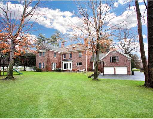 5 Shields Lane Darien, CT 06820 - Photo 20 of 20 a front view of a house with a yard