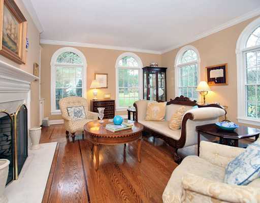 5 Shields Lane Darien, CT 06820 - Photo 4 of 20 a living room with furniture fireplace and a large window