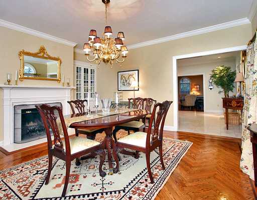 5 Shields Lane Darien, CT 06820 - Photo 6 of 20 a dining room with furniture a chandelier and wooden floor