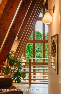 a view of balcony with chairs and wooden fence