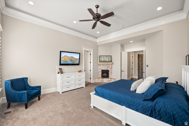 1205 North Elk Rdg Lane, Unit 202 Alpine, UT 84004 - Photo 27 of 88 Spacious room featuring tray ceiling with recessed lighting and a ceiling fan, a corner fireplace with stacked stone surround, and carpet flooring