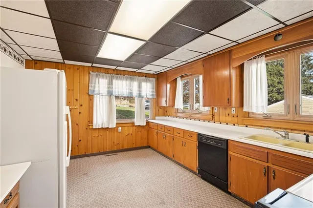 a large kitchen with a large window