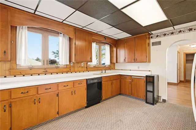 a kitchen with sink cabinets and window