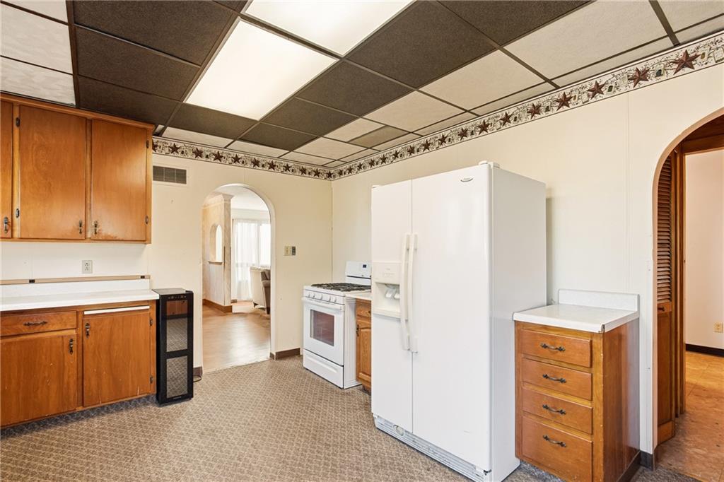 372 Lincoln Street Somerset, PA 15501 - Photo 17 of 50 a kitchen with stainless steel appliances a stove and a refrigerator