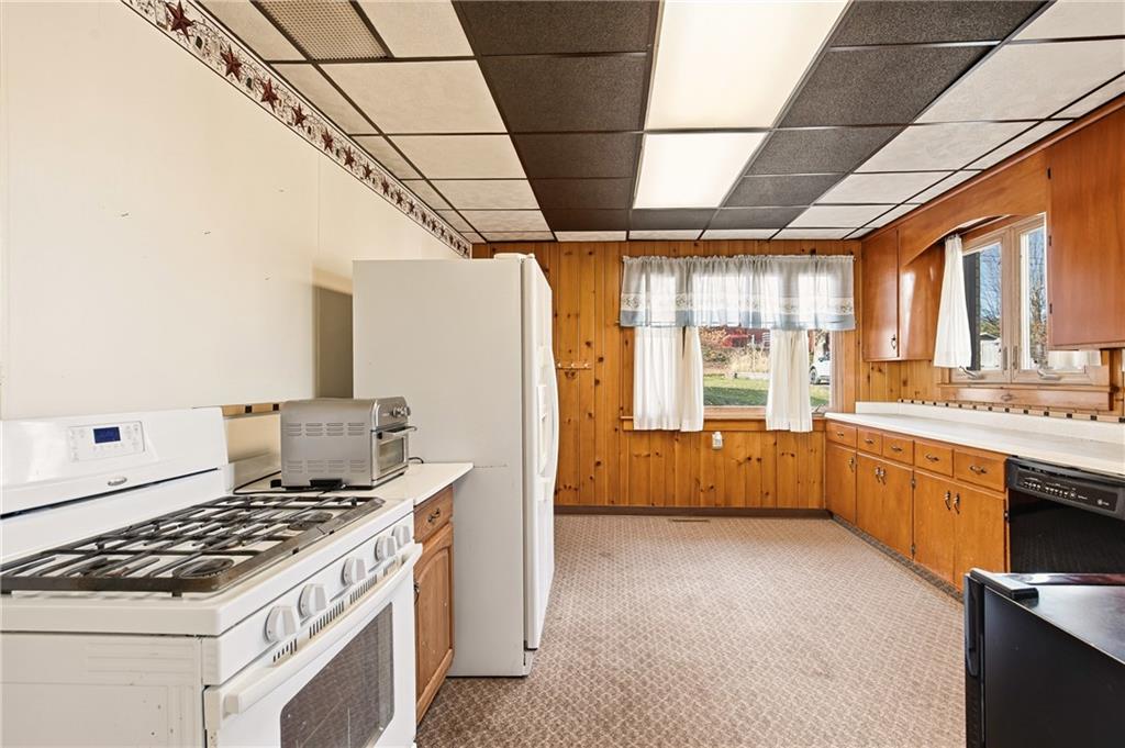 372 Lincoln Street Somerset, PA 15501 - Photo 18 of 50 a kitchen with stainless steel appliances granite countertop a stove a sink dishwasher and a refrigerator