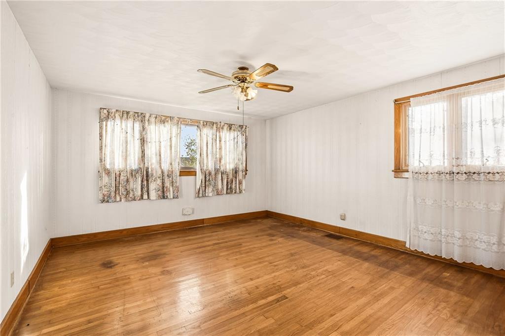 372 Lincoln Street Somerset, PA 15501 - Photo 19 of 50 an empty room with wooden floor and windows