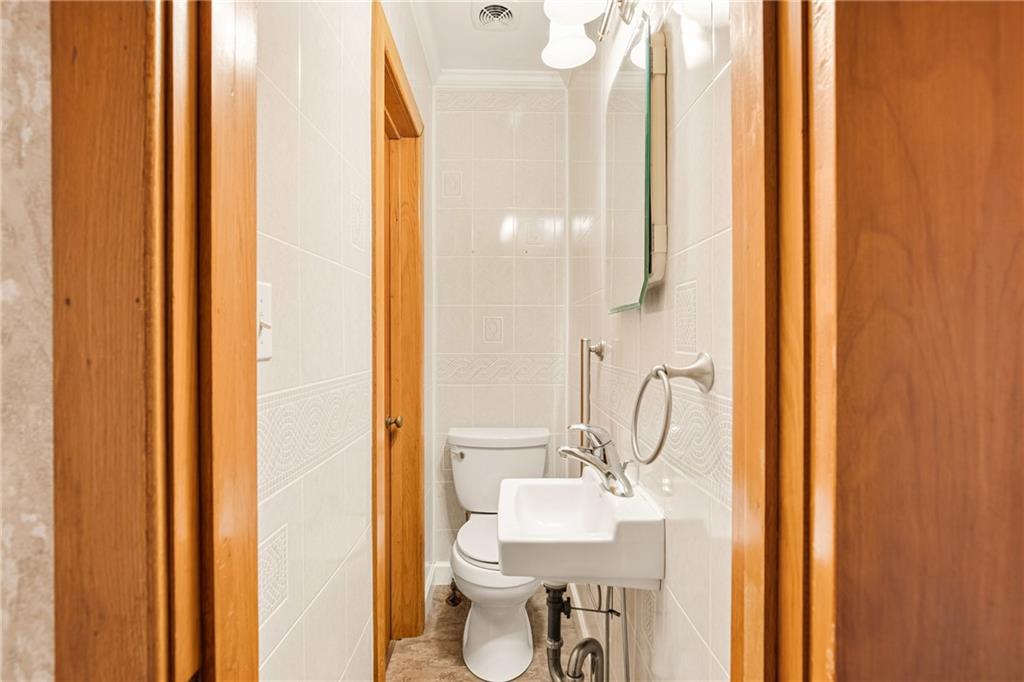 372 Lincoln Street Somerset, PA 15501 - Photo 23 of 50 a bathroom with a sink toilet and shower