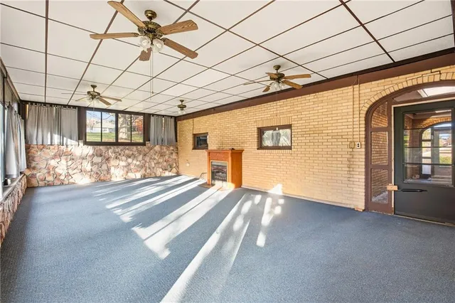 a view of a pathway along with brick walls