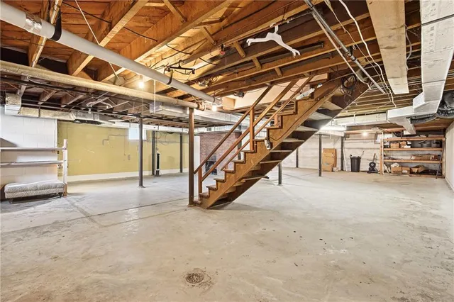 a yellow house with swimming pool in front of it
