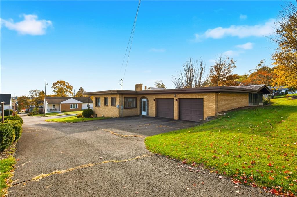 372 Lincoln Street Somerset, PA 15501 - Photo 43 of 50 a view of a house with a backyard and a tree