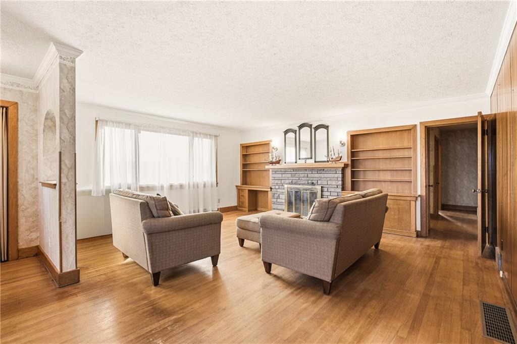 372 Lincoln Street Somerset, PA 15501 - Photo 10 of 50 a living room with furniture and a fireplace
