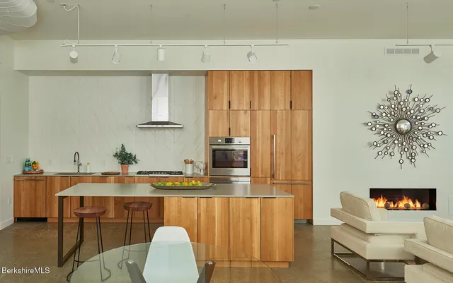 a dining room with furniture and a fireplace