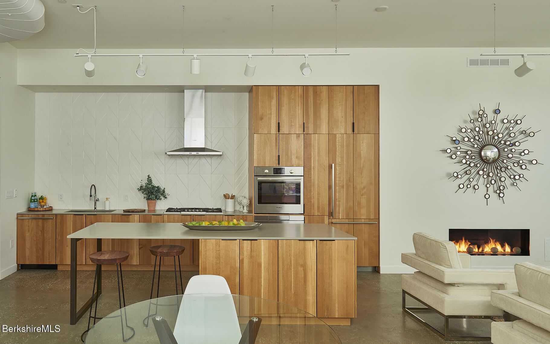1 River Run Road, Unit 1 Williamstown, MA 01267 - Photo 5 of 15 a dining room with furniture and a fireplace
