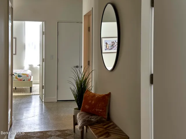 a view of a livingroom with furniture and entryway