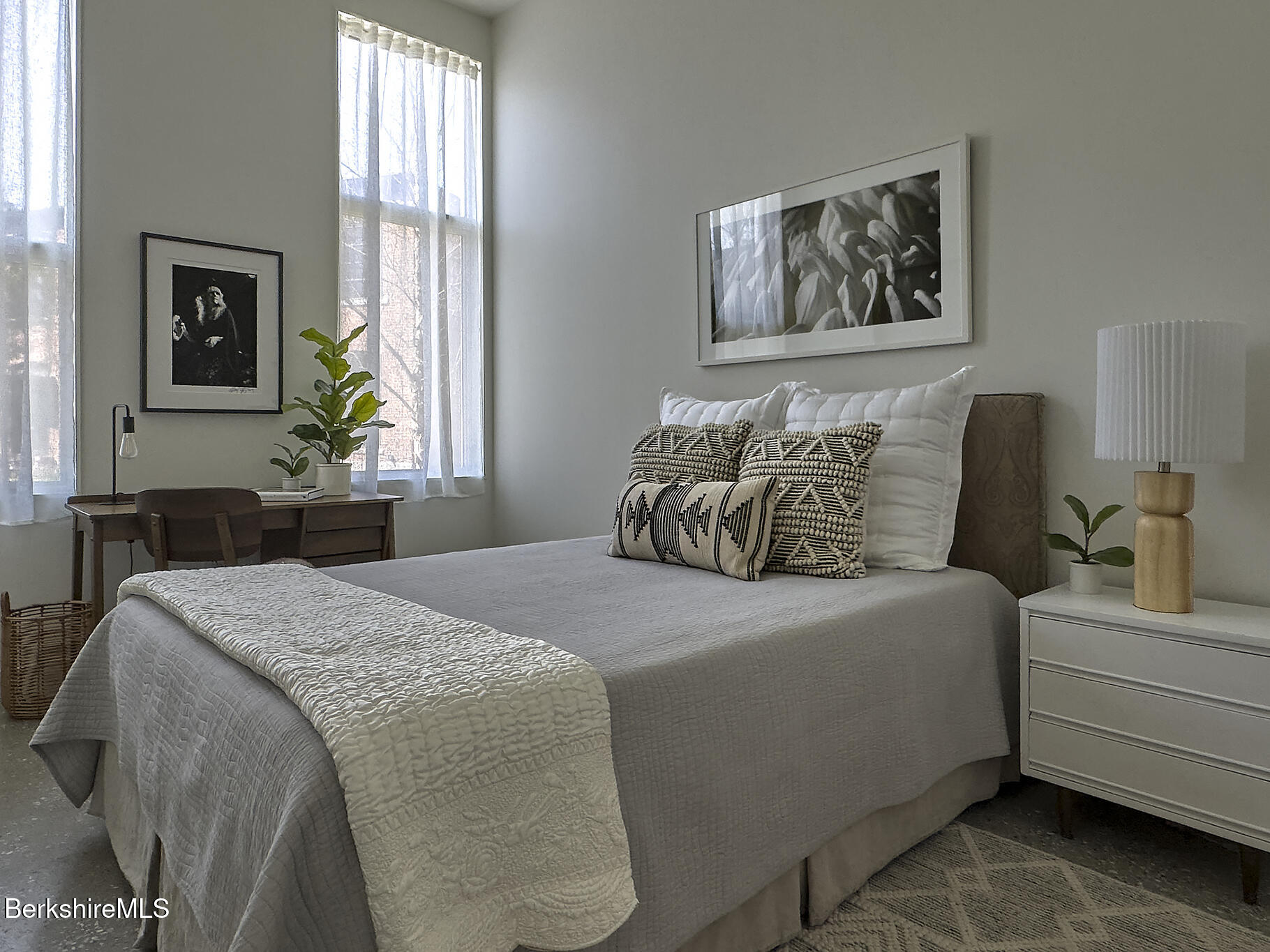 1 River Run Road, Unit 1 Williamstown, MA 01267 - Photo 8 of 15 a bedroom with a bed and a chandelier