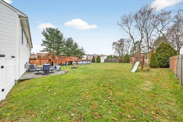 a view of yard with swimming pool