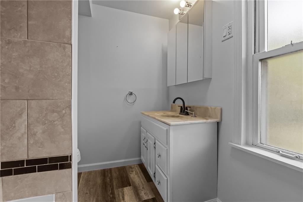 319 Center Grange Road Monaca, PA 15061 - Photo 13 of 24 a room with a sink and a mirror