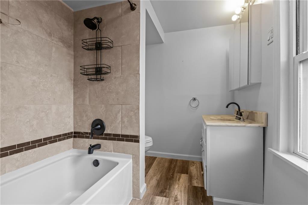 319 Center Grange Road Monaca, PA 15061 - Photo 14 of 24 a bathroom with a tub and sink