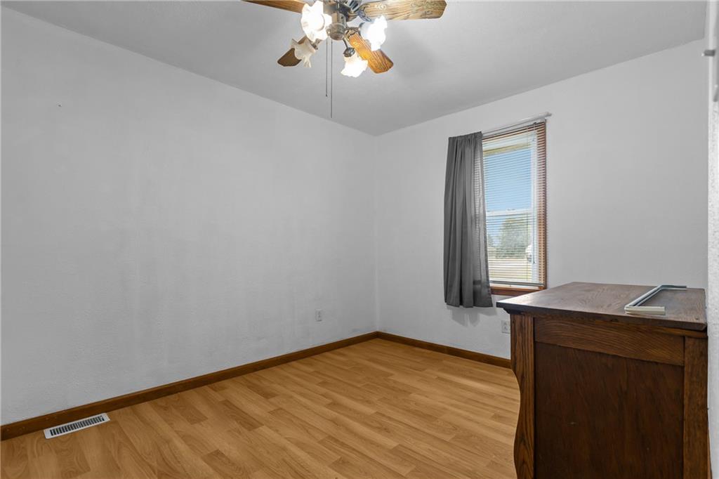 319 Center Grange Road Monaca, PA 15061 - Photo 19 of 24 a view of empty room with window and wooden floor