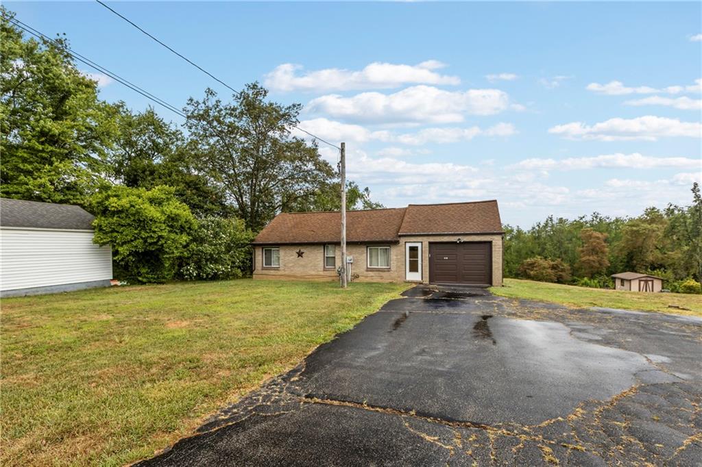 319 Center Grange Road Monaca, PA 15061 - Photo 2 of 24 a view of a house with backyard and trees