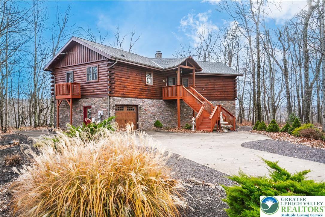 720 Turnberry Lane Hazleton, PA 18202 - Photo 1 of 1 a front view of a house with a yard and garage