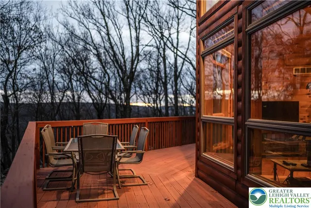 a spacious bedroom with a bed and glass table