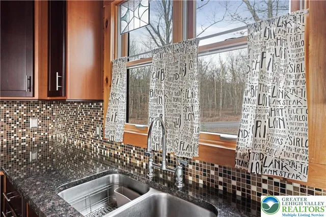 a view of beach and small yard