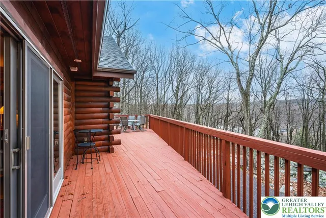a kitchen with stainless steel appliances granite countertop a sink and a refrigerator