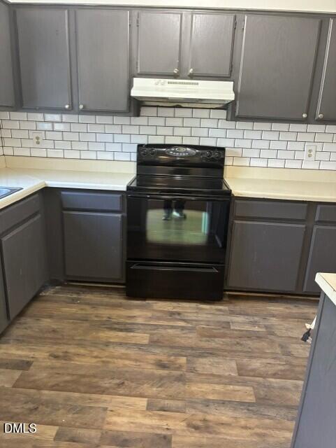3104 Crandon Lane Raleigh, NC 27604 - Photo 4 of 10 a kitchen with granite countertop a stove top oven microwave and cabinets