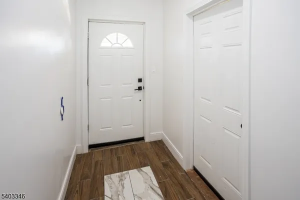 a view of bathroom with wooden floor