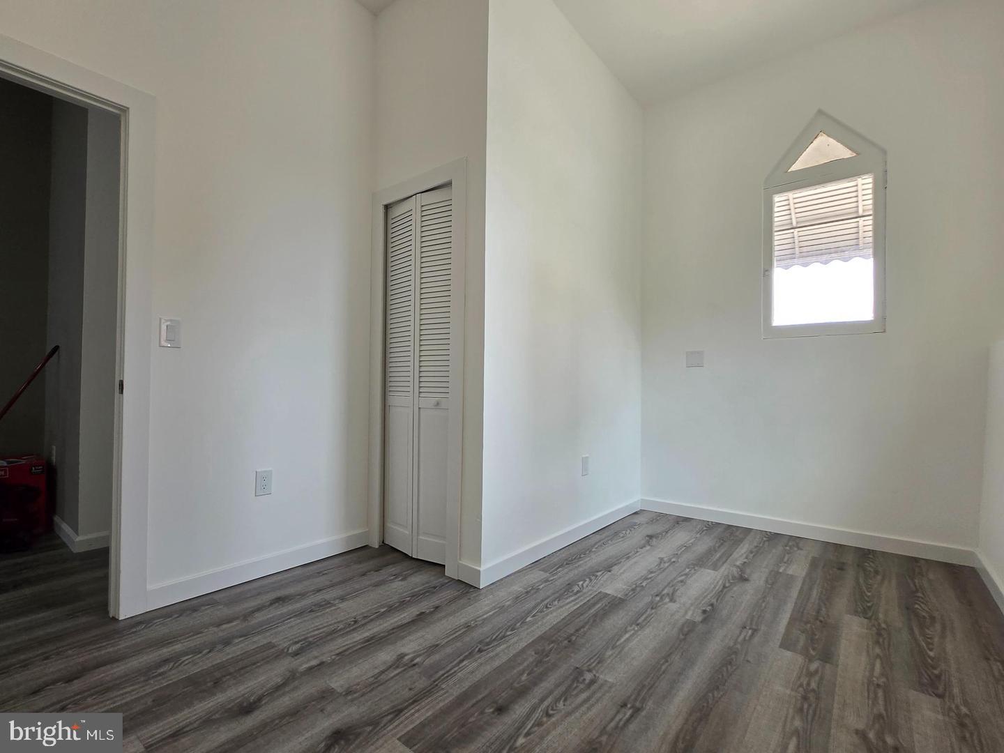 1218 North 16th Street Philadelphia, PA 19121 - Photo 12 of 33 a view of a room with wooden floor and a window