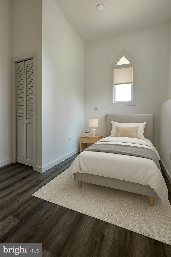 1218 North 16th Street Philadelphia, PA 19121 - Photo 14 of 33 a bedroom with a bed and a window