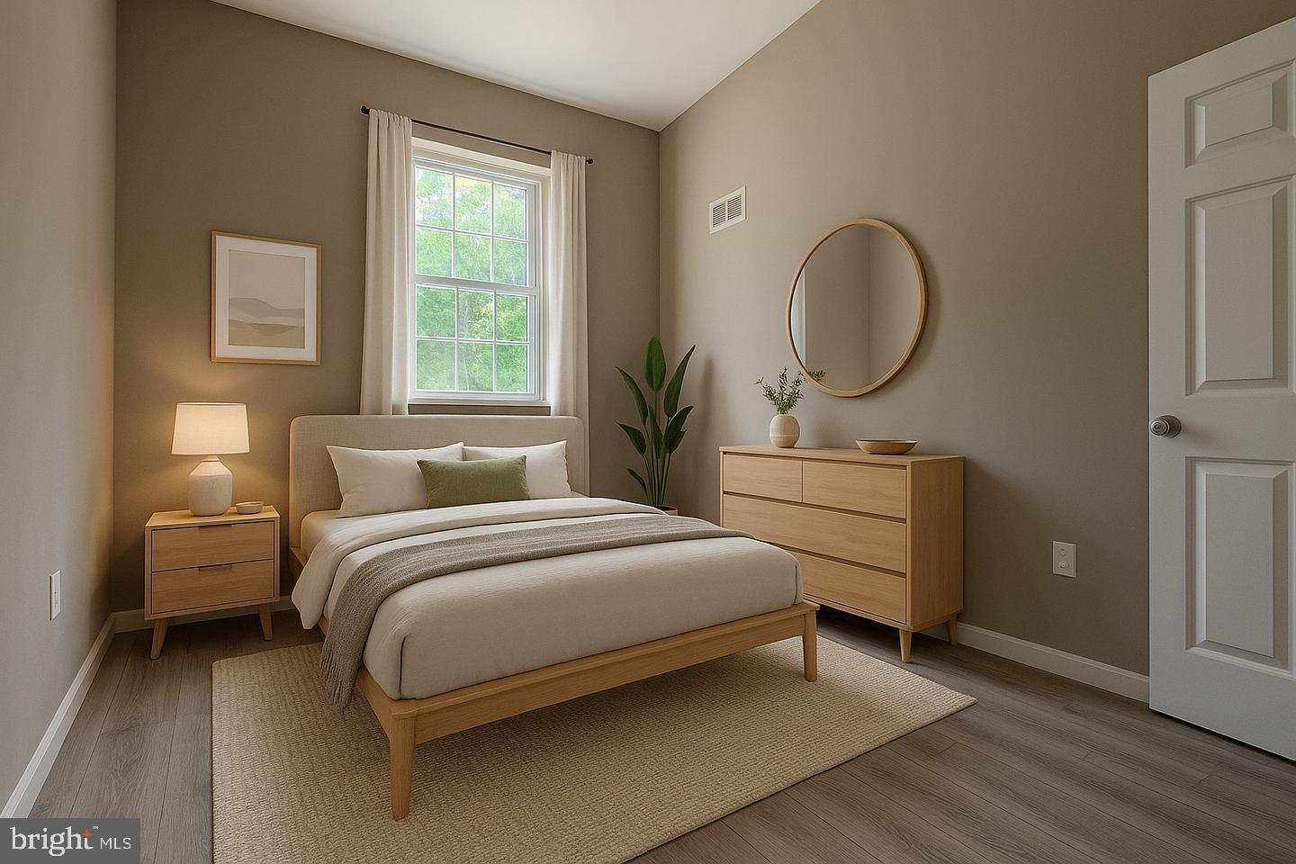 1218 North 16th Street Philadelphia, PA 19121 - Photo 19 of 33 a bedroom with a bed and a chandelier