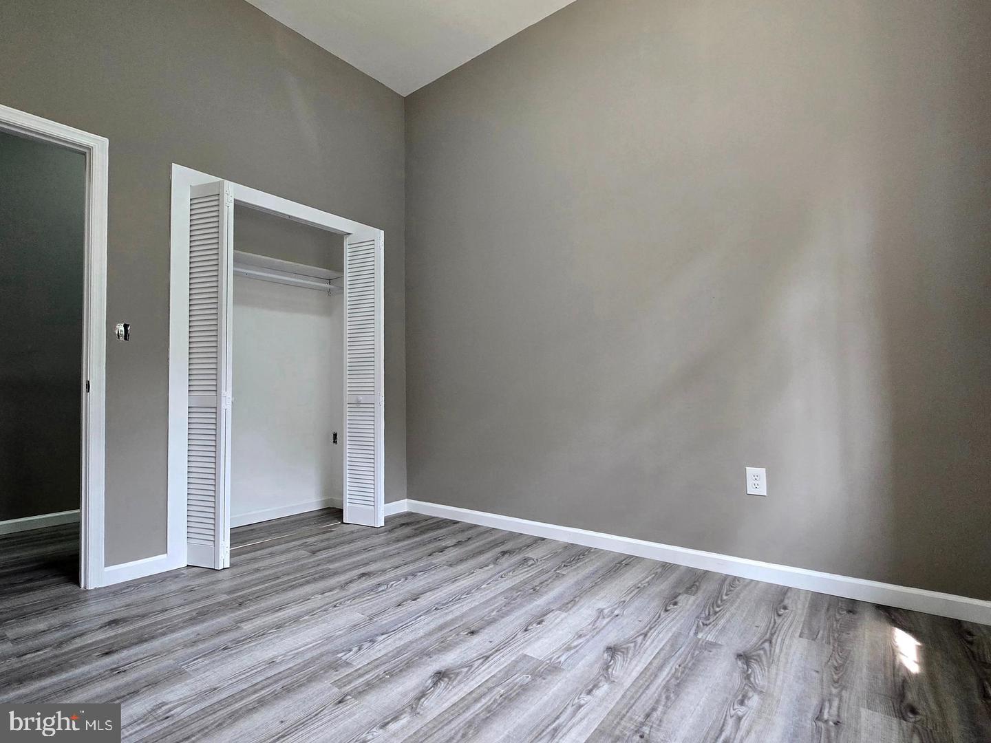 1218 North 16th Street Philadelphia, PA 19121 - Photo 21 of 33 a view of an empty room with wooden floor and closet