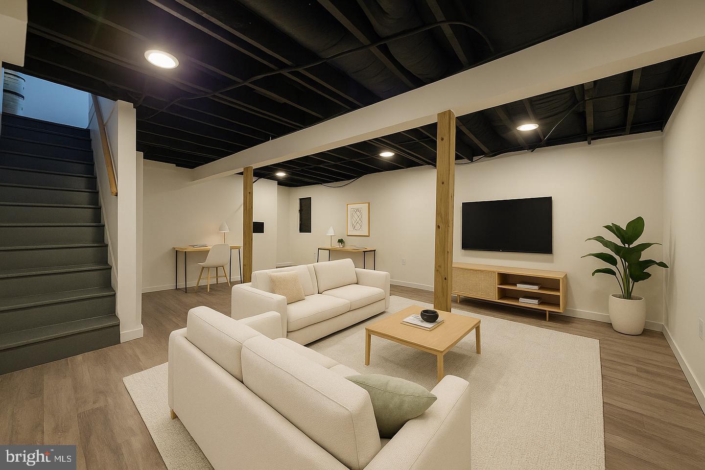 1218 North 16th Street Philadelphia, PA 19121 - Photo 32 of 33 a living room with furniture and a flat screen tv
