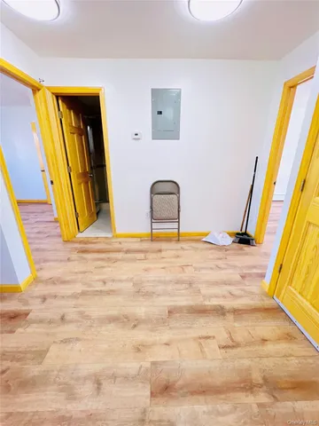 a view of a room with a sink and a bed