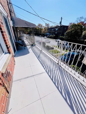 a view of balcony with furniture