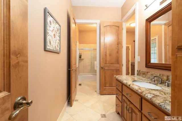 a bathroom with a sink a vanity and a mirror