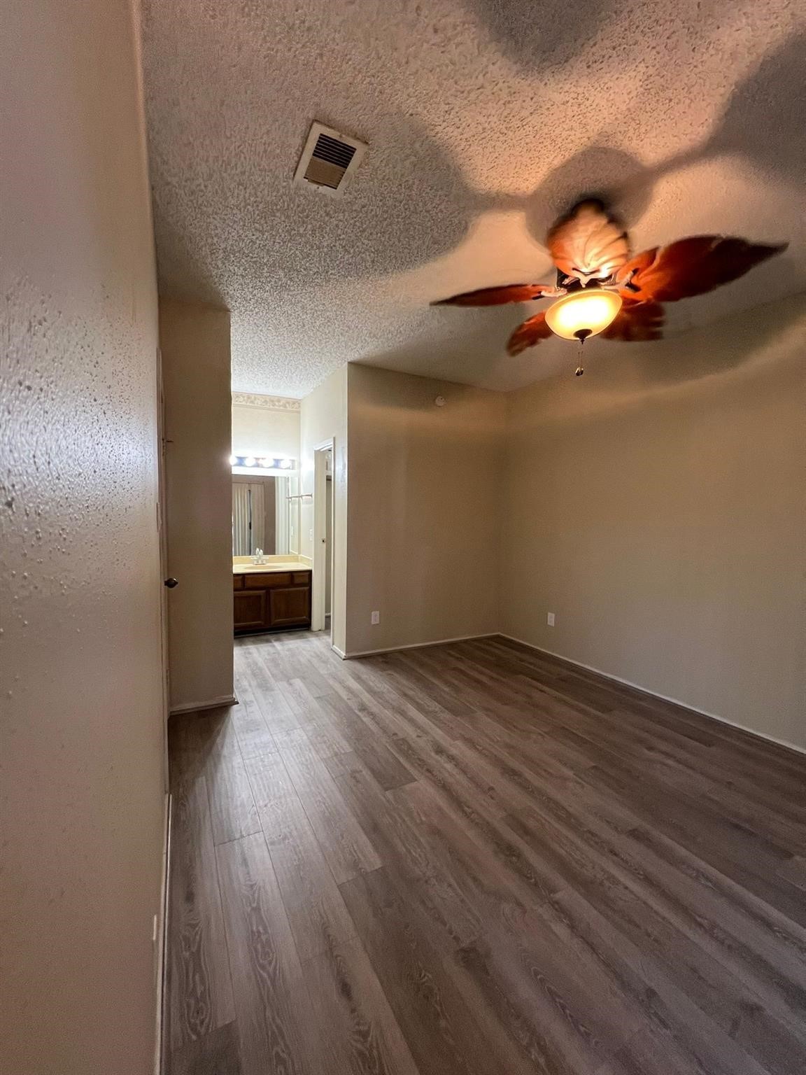17417 Red Oak Drive, Unit 106 Houston, TX 77090 - Photo 5 of 7 a view of an empty room with wooden floor