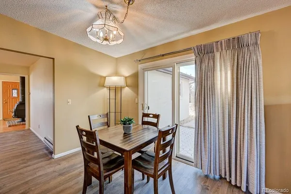 a view of a dining room with furniture window and wooden floor