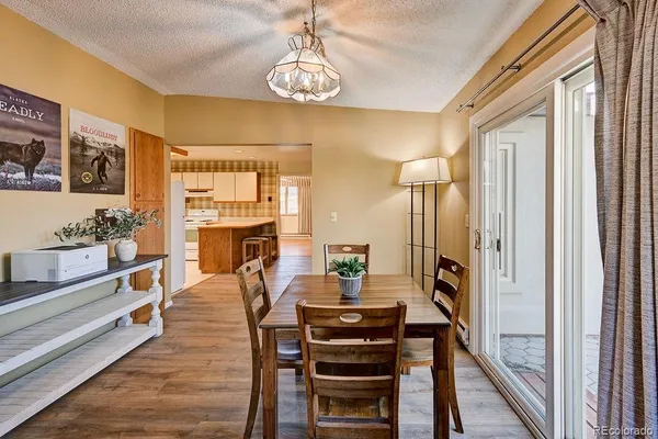 a view of a dining room with furniture window and wooden floor