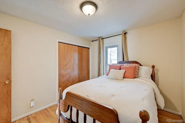 a bedroom with a bed and window