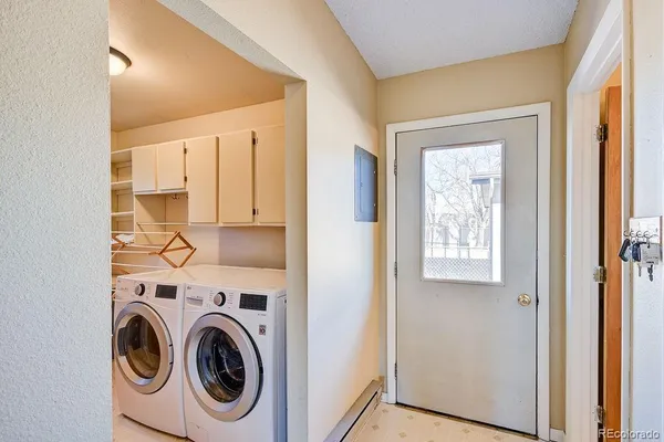 a view of hallway with washer and dryer