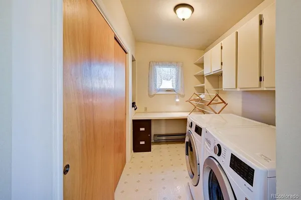 a view of cabinets and washer dryer