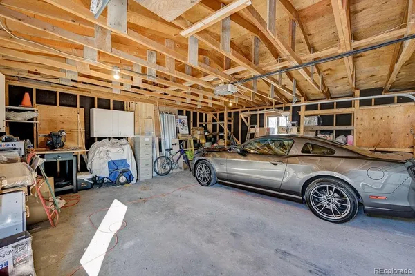 a view of parking garage with cars