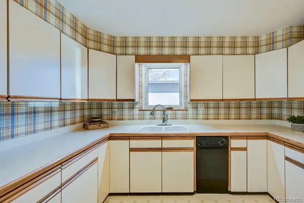 a kitchen with a sink and cabinets